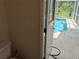 Doorway access from the bathroom to the refreshing outdoor pool area at 4823 Foxhall Rd, North Port, FL 34288
