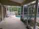 Inviting pool area with lush landscaping, offering a serene retreat with convenient access to the home at 4823 Foxhall Rd, North Port, FL 34288