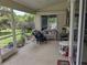 Inviting screened porch with comfortable seating, ideal for relaxing outdoors at 4823 Foxhall Rd, North Port, FL 34288