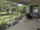 Relaxing screened porch with views of the landscaped backyard at 4823 Foxhall Rd, North Port, FL 34288