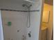 Tiled shower with blue accent tiles and modern shower head at 4823 Foxhall Rd, North Port, FL 34288