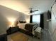 Comfortable bedroom with ceiling fan, gray walls, and carpet at 4854 Flamlau Ave, North Port, FL 34287