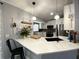 Well-lit kitchen featuring modern countertops, stainless steel appliances, and stylish pendant lighting at 4854 Flamlau Ave, North Port, FL 34287