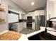 A bright kitchen with white cabinets and stainless steel appliances awaits its new owners at 4854 Flamlau Ave, North Port, FL 34287