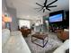 Spacious living room with stylish furniture, open floor plan, and modern lighting at 4854 Flamlau Ave, North Port, FL 34287