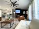 Well-decorated living space featuring modern elements, an open kitchen view, and comfortable seating at 4854 Flamlau Ave, North Port, FL 34287