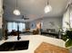 This living room features contemporary decor and a view from the kitchen at 4854 Flamlau Ave, North Port, FL 34287