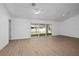 Spacious living room with sliding glass doors leading to the outdoor area at 49 Troutdale St, Port Charlotte, FL 33954