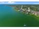 Stunning aerial view of waterfront property showcasing the building's location, surrounding landscape, and dock access at 53 W Bay Heights Rd # 307, Englewood, FL 34223