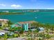 Beautiful aerial view of the condo community with waterfront views and boat access in a tropical setting at 53 W Bay Heights Rd # 307, Englewood, FL 34223