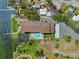 Aerial view of home with a pool and a beautiful waterfront view and parking at 53 W Bay Heights Rd # 307, Englewood, FL 34223