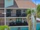 View of the screened in condo balcony with an updated railing and waterfront view at 53 W Bay Heights Rd # 307, Englewood, FL 34223