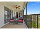 Enjoy this spacious balcony with comfortable seating, a ceiling fan, and scenic views for outdoor relaxation and entertainment at 53 W Bay Heights Rd # 307, Englewood, FL 34223