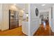 Spacious white kitchen featuring stainless steel appliances, wooden floors, and granite countertops at 53 W Bay Heights Rd # 307, Englewood, FL 34223