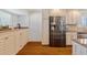 Elegant kitchen with stainless steel refrigerator, granite countertops, and stylish cabinets at 53 W Bay Heights Rd # 307, Englewood, FL 34223