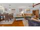 Open living space with hardwood floors, stylish furnishings, art, and decorative screen detail at 53 W Bay Heights Rd # 307, Englewood, FL 34223