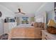 Relaxing main bedroom featuring a large bed, balcony access, and a dresser at 53 W Bay Heights Rd # 307, Englewood, FL 34223