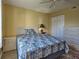 Bedroom with comfortable bed, dresser and convenient bedside table for storage at 5725 Greenwood Ave # 5103, North Port, FL 34287