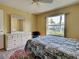 Bright bedroom featuring a comfortable bed, and spacious dresser for a relaxing retreat at 5725 Greenwood Ave # 5103, North Port, FL 34287