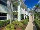 Two-story building exterior features a blend of classic design and well maintained landscaping at 5725 Greenwood Ave # 5103, North Port, FL 34287
