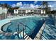 Take a refreshing dip in the pristine community pool with easy access steps and lounging area at 5725 Greenwood Ave # 5103, North Port, FL 34287