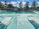 Enjoy the expansive community pool, surrounded by sun loungers and lush landscaping at 5725 Greenwood Ave # 5103, North Port, FL 34287