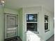 Charming entrance featuring a screen door, house number, and welcoming 'HOME' doormat at 5725 Greenwood Ave # 5103, North Port, FL 34287