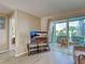 View of living room with sliding glass doors that opens up to a patio at 5725 Greenwood Ave # 5103, North Port, FL 34287