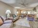 Cozy living room featuring a ceiling fan, comfortable seating and an open floor plan at 5725 Greenwood Ave # 5103, North Port, FL 34287