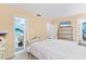 Bedroom featuring neutral tones and an ensuite bathroom at 5983 Hobhill Ave, North Port, FL 34287
