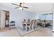Shared dining and living space featuring a dining table with six chairs, connecting to the living area at 5983 Hobhill Ave, North Port, FL 34287