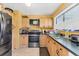 Efficient kitchen with stainless steel appliances, laminate counters, and ample cabinet space at 5983 Hobhill Ave, North Port, FL 34287