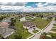 Gorgeous aerial view of home near water and green golf course at 609 Monaco Dr, Punta Gorda, FL 33950