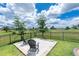 Relaxing backyard space with patio and chairs for enjoying water view at 609 Monaco Dr, Punta Gorda, FL 33950