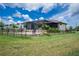 Well-maintained backyard features a covered lanai, patio and lush lawn at 609 Monaco Dr, Punta Gorda, FL 33950