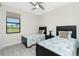 Charming bedroom with twin beds, providing a cozy and inviting space at 609 Monaco Dr, Punta Gorda, FL 33950