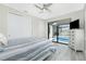 Comfortable bedroom featuring direct access to the pool, a ceiling fan and neutral decor at 609 Monaco Dr, Punta Gorda, FL 33950
