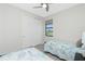 Functional bedroom includes a pair of twin beds, a sliding door closet and a window with view at 609 Monaco Dr, Punta Gorda, FL 33950