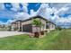 Beautiful home boasts mature landscaping, brick driveway, and two car garage at 609 Monaco Dr, Punta Gorda, FL 33950