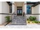 Front entry features double doors, stone stairs and professional landscaping at 609 Monaco Dr, Punta Gorda, FL 33950