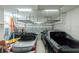 Well-lit garage with storage racks, ample parking, and overhead lighting at 609 Monaco Dr, Punta Gorda, FL 33950