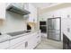 Bright, modern kitchen featuring granite countertops and stainless appliances at 609 Monaco Dr, Punta Gorda, FL 33950