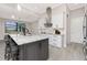 Stylish kitchen island with granite countertops, modern appliances, and ample cabinet space for a chef's delight at 609 Monaco Dr, Punta Gorda, FL 33950