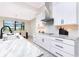 Well-lit kitchen showcasing countertops, modern appliances, and backsplash, perfect for creating culinary masterpieces at 609 Monaco Dr, Punta Gorda, FL 33950
