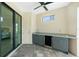 The covered lanai features a wet bar and beverage fridge, all situated on stone-look pavers at 609 Monaco Dr, Punta Gorda, FL 33950