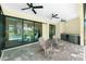 Outdoor seating and a wet bar are featured on this lanai, which opens to the pool at 609 Monaco Dr, Punta Gorda, FL 33950