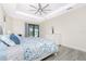 Bright main bedroom featuring tile floors and a sliding door to the pool area at 609 Monaco Dr, Punta Gorda, FL 33950