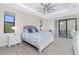 Beautiful main bedroom featuring stylish furniture, ceiling fan, and ample natural light at 609 Monaco Dr, Punta Gorda, FL 33950