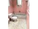 Bathroom with pink tile and classic fixtures, ready for a personalized remodel at 617 W Olympia Ave, Punta Gorda, FL 33950
