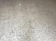 Close-up of speckled floor, showcasing its unique texture and neutral palette at 617 W Olympia Ave, Punta Gorda, FL 33950